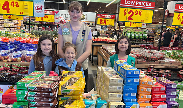 girl scout troop in H-E-B at a cookie booth