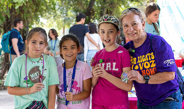 Girls posing for photo with the Girl Scouts of Southwest Texas CEO