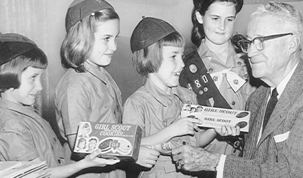 Black and white photo of girls with cookies from the 1900s