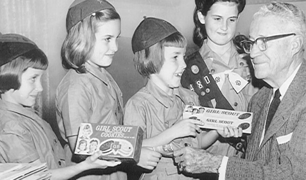 Black and white photo of girls with cookies from the 1900s