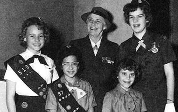 1960s image of Lady Baden-Powell visiting San Antonio posing next to girl scouts
