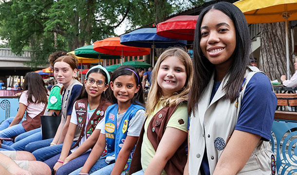 Girl Scouts sitting on a riverboat in downtown San Antonio