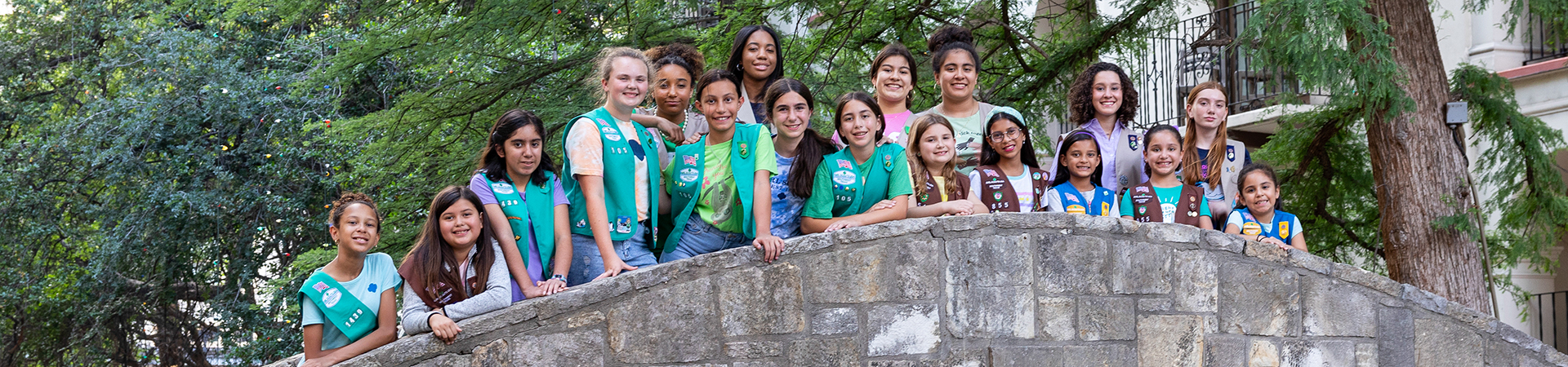  Large group of girl scouts standing on a bridge at the San Antonio riverwalk 