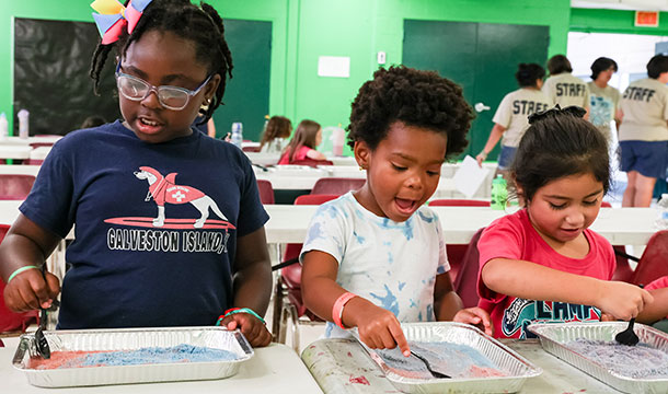 girl scouts doing an activity at camp metro