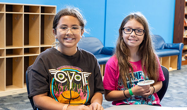 girl scouts sitting at camp metro