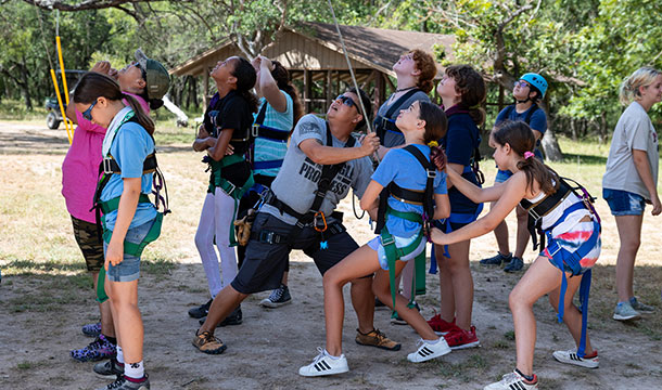 girls helping at the ropes course