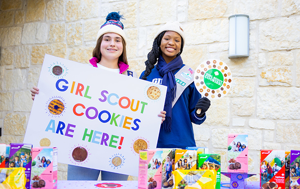 Girl scouts at their cookie booth 