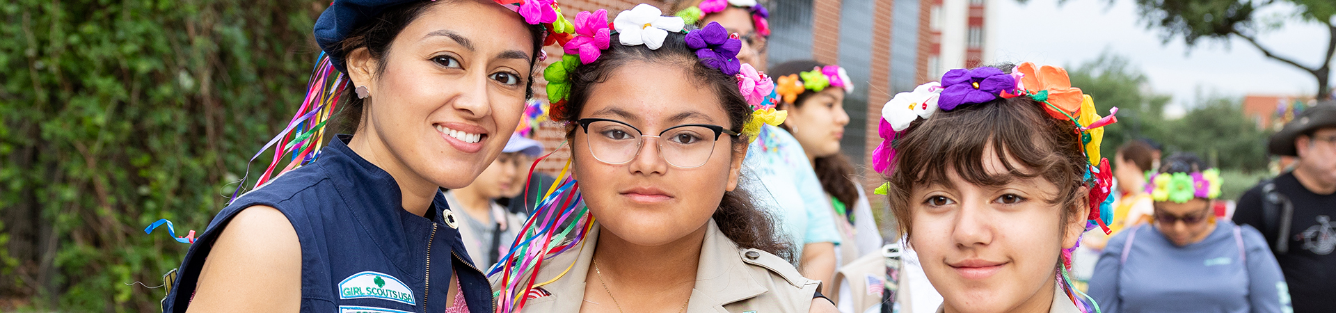  girl scouts mom volunteer with two girls 