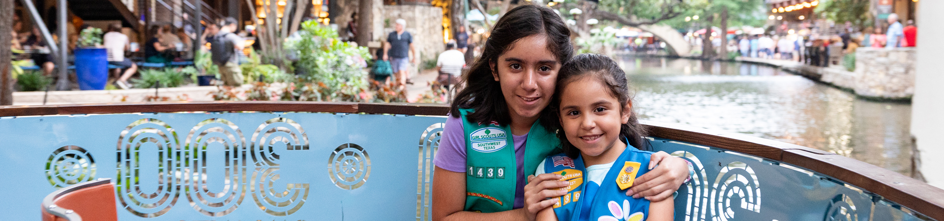  two girl scout sisters smiling 