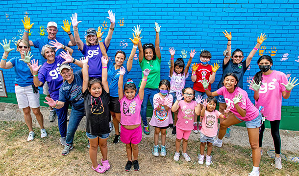 Volunteers painting at our west side girl scout leadership center