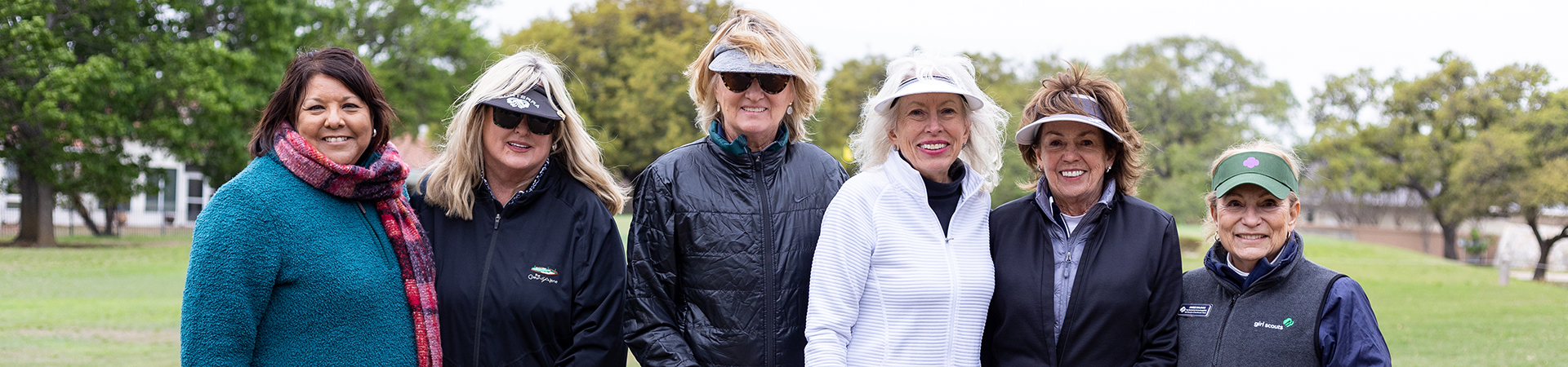  Golf tournament team posing at golf course 